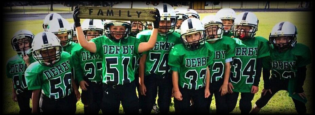 Derby Junior Football team holding a FAMILY sign